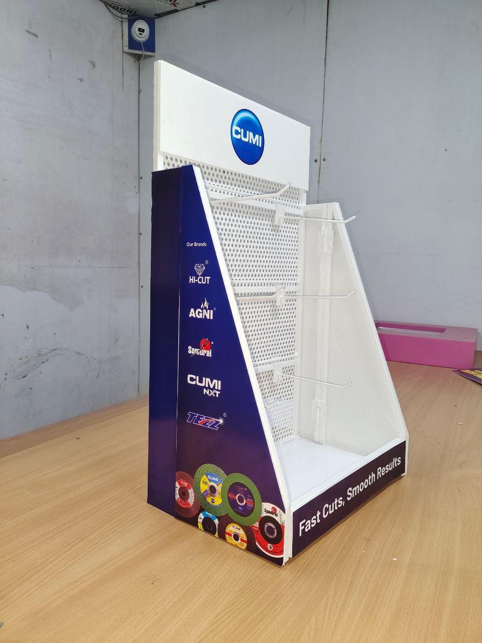 Professional installation team setting up a retail display fixture in a store
